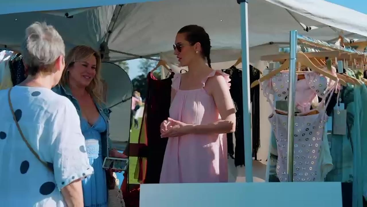 Shoppers at a dress rack, 2025
