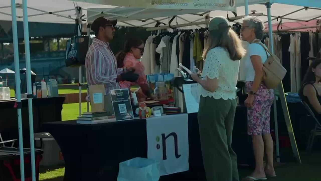 Shoppers at a vendor stall, 2025